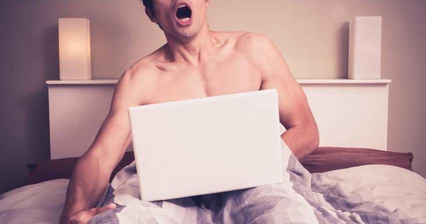 Young Man Sitting Bed Watching Pornography